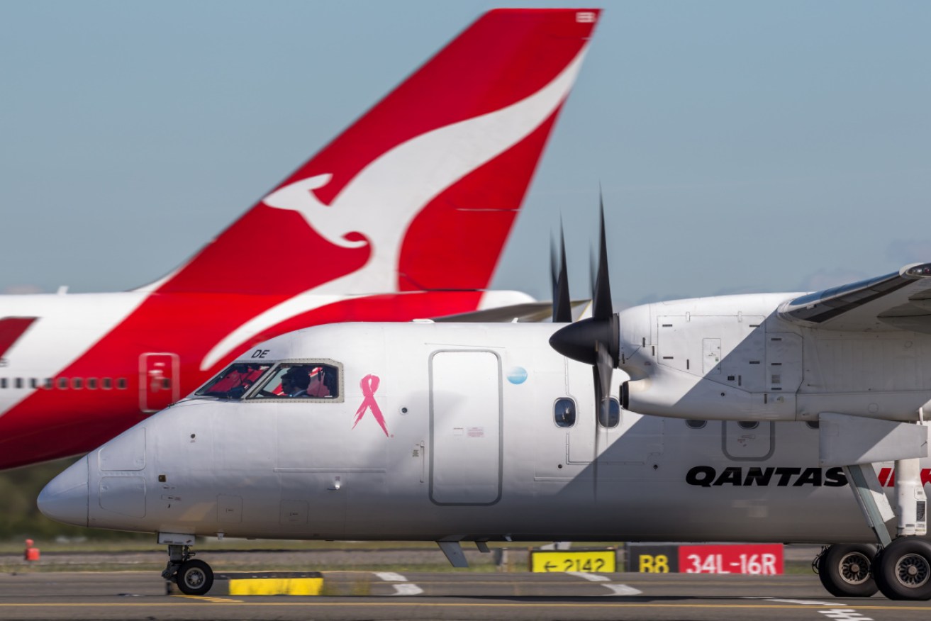 The flight attendant was was infectious while she travelled between Brisbane and Longreach.