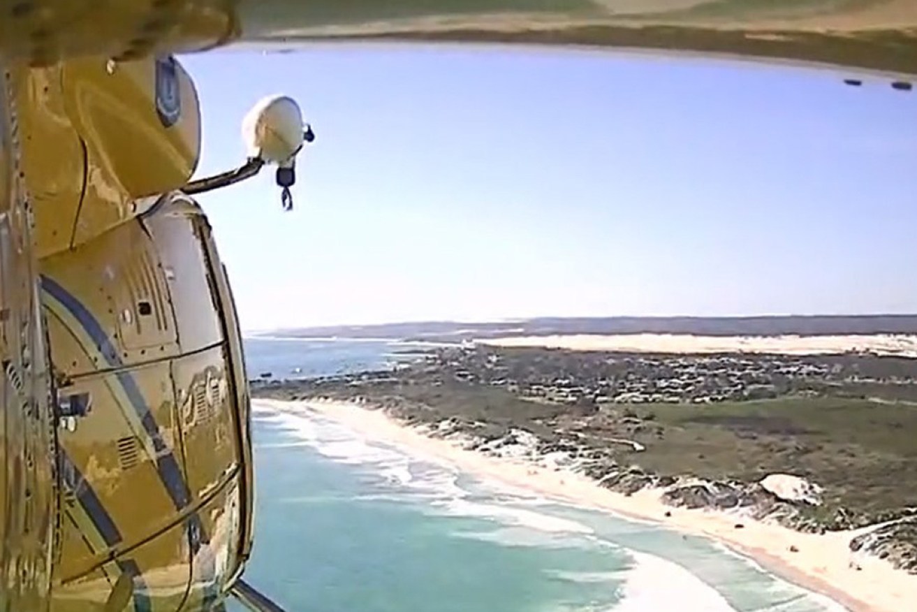 The girl and her father were flown to hospital after spending hours in rough seas.