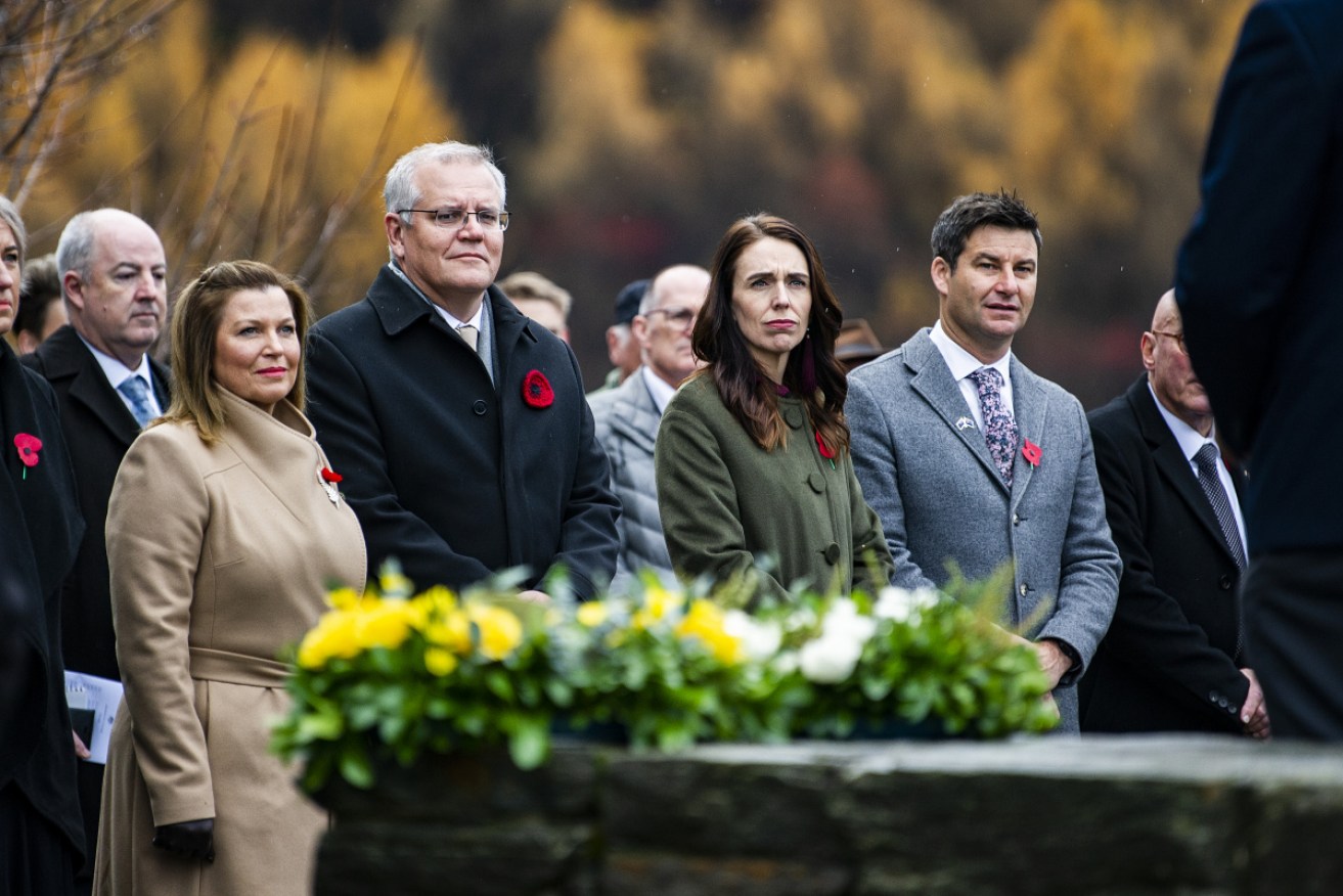 Scott Morrison (with wife Jenny) and Jacinda Ardern (with fiance Clarke Gayford) at the wreath-laying ceremony in Arrowtown on Monday.