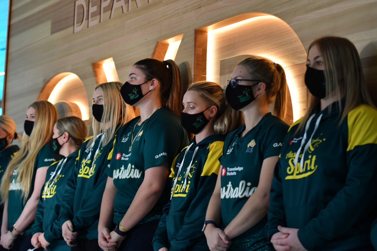 Members of the Aussie Spirit, Australia’s Olympic softball team, depart from Sydney on Monday. 