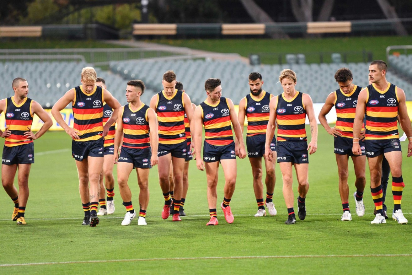 The Crows were fined by the AFL after not wearing face masks on a flight from Sydney to Adelaide last week.