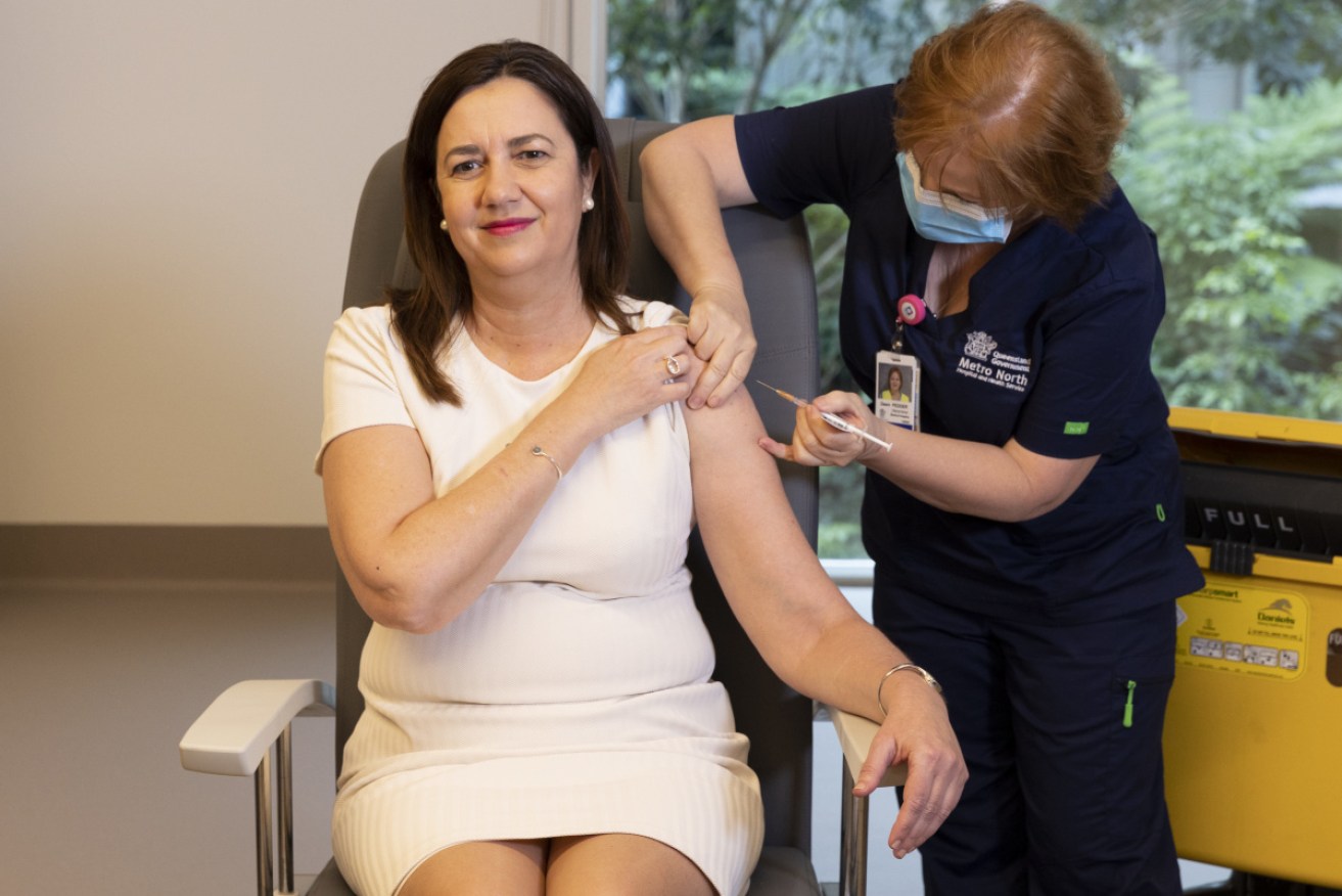 Premier Annastacia Palaszczuk received her first Pfizer dose from nurse Dawn Pedder on Monday.