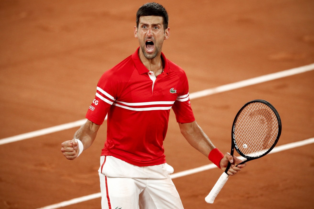 Novak Djokovic reacts to his win over Matteo Berrettini in their French Open quarter-final. 