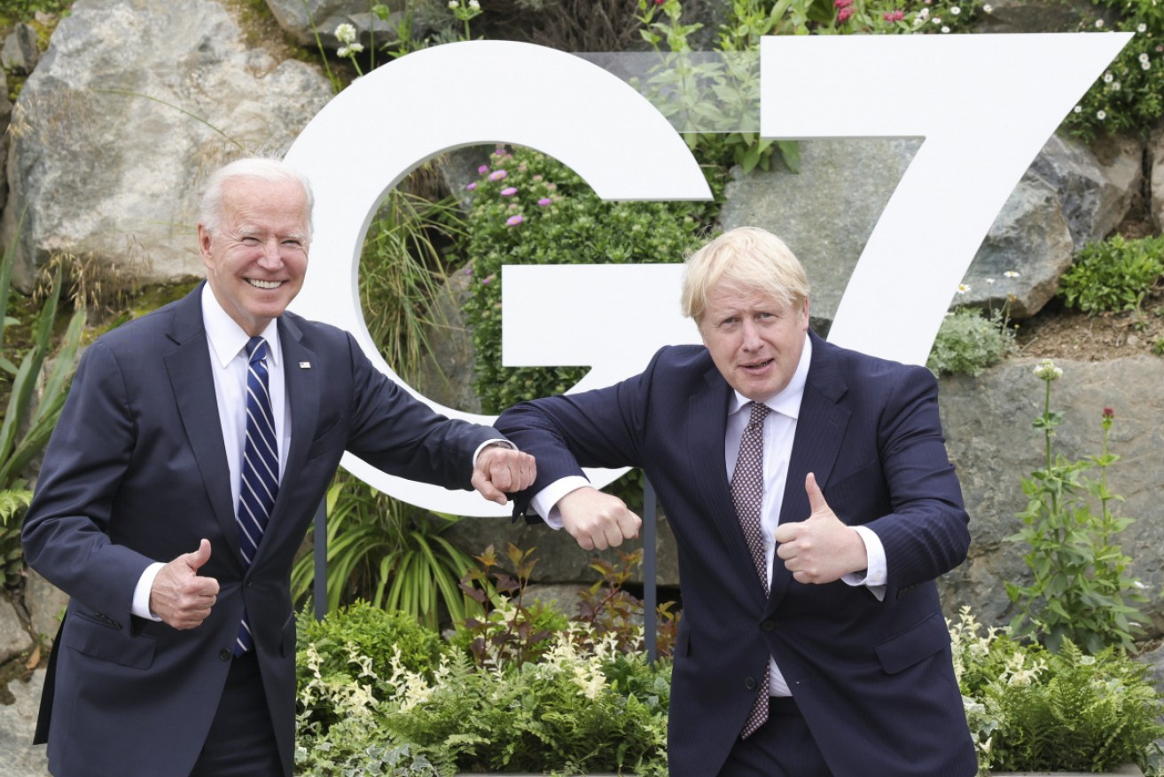 Mr Biden and Mr Johnson lark it up for the cameras as they meet for the first time in Cornwall, ahead of this weekend's G7.