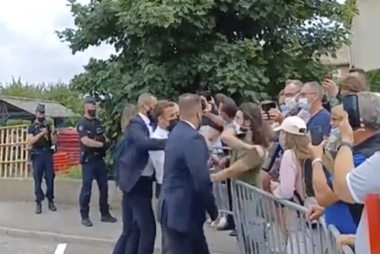 The perpetrator was caught on camera slapping French President Emmanuel Macron.