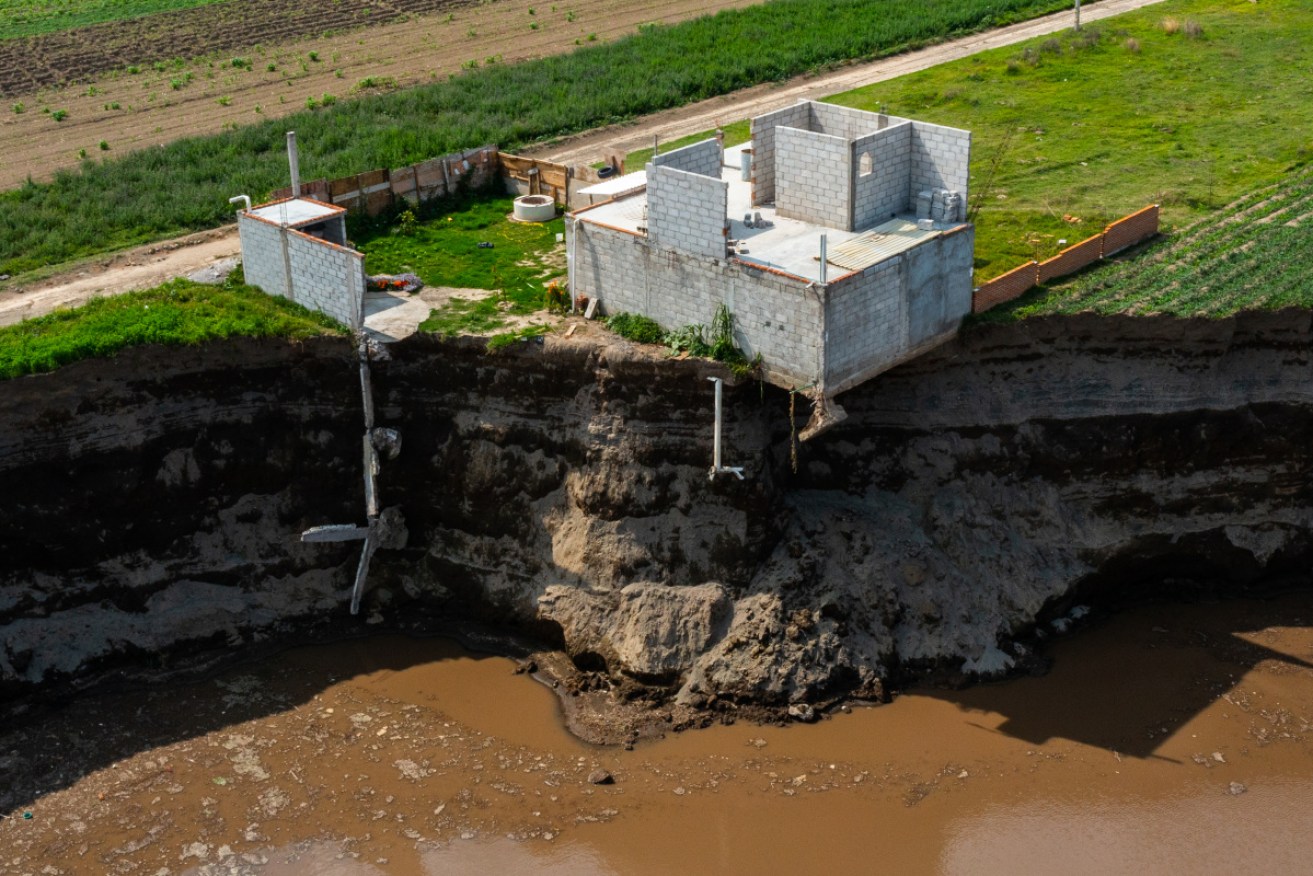 The rapidly widening sinkhole is about the swallow this house.