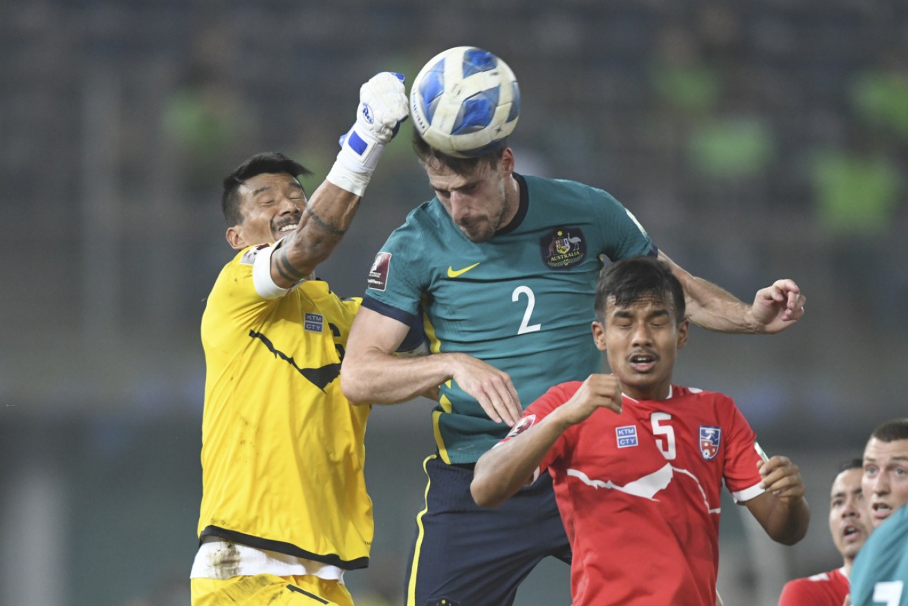 Milos Degenek challenges for the ball during the Socceroos' 3-0 World Cup qualifying win over Nepal.