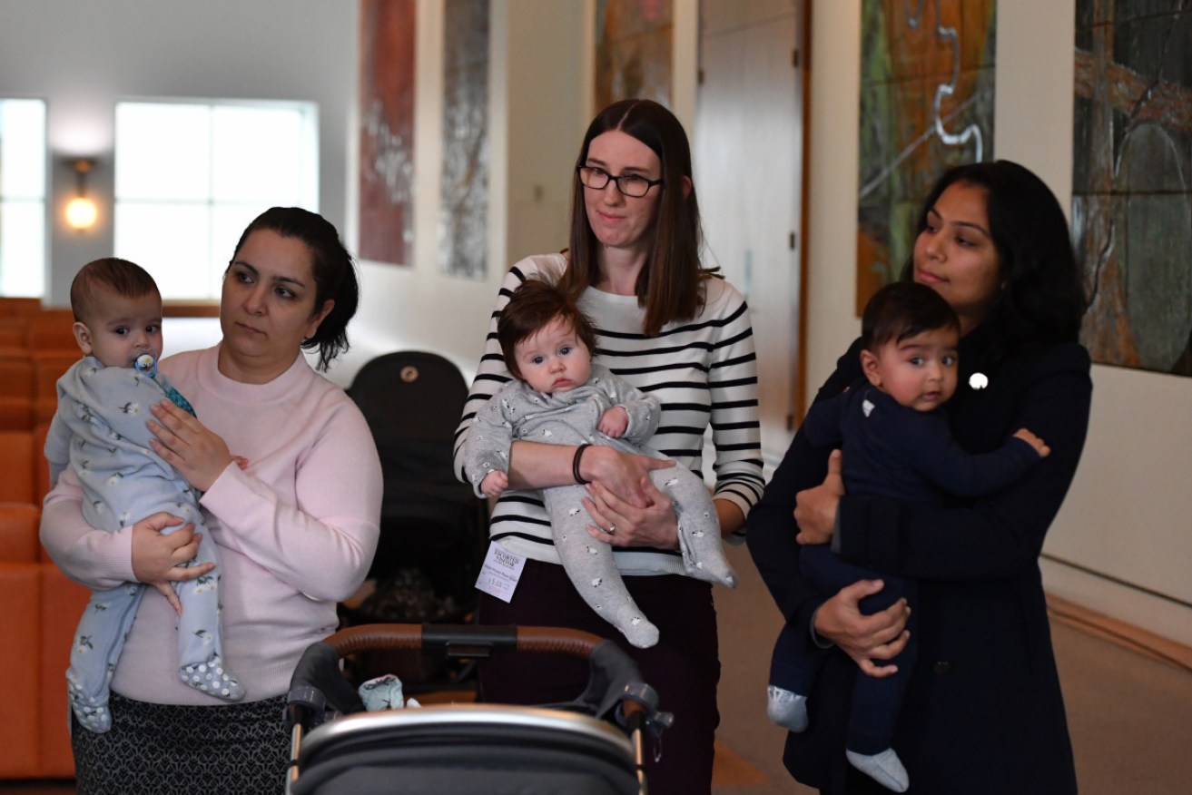 Azadeh Oskouipour and Xanir 6 months, Sophie Robinson and Lucy 4 months and Monal Vachhani and Aneev 5 and a half months in Canberra on Tuesday.
