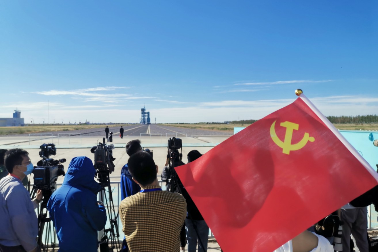 A patriotic crowd gathered to watch the mission blast off.