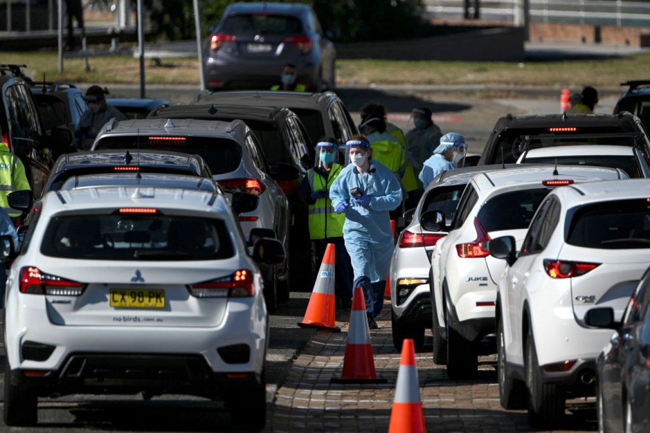 A man has been charged after allegedly driving at a security guard at a testing clinic in Sydney.