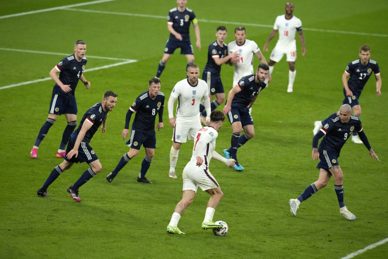 England substitute Jack Grealish faces a wall of Scottish defenders in their goalless draw.