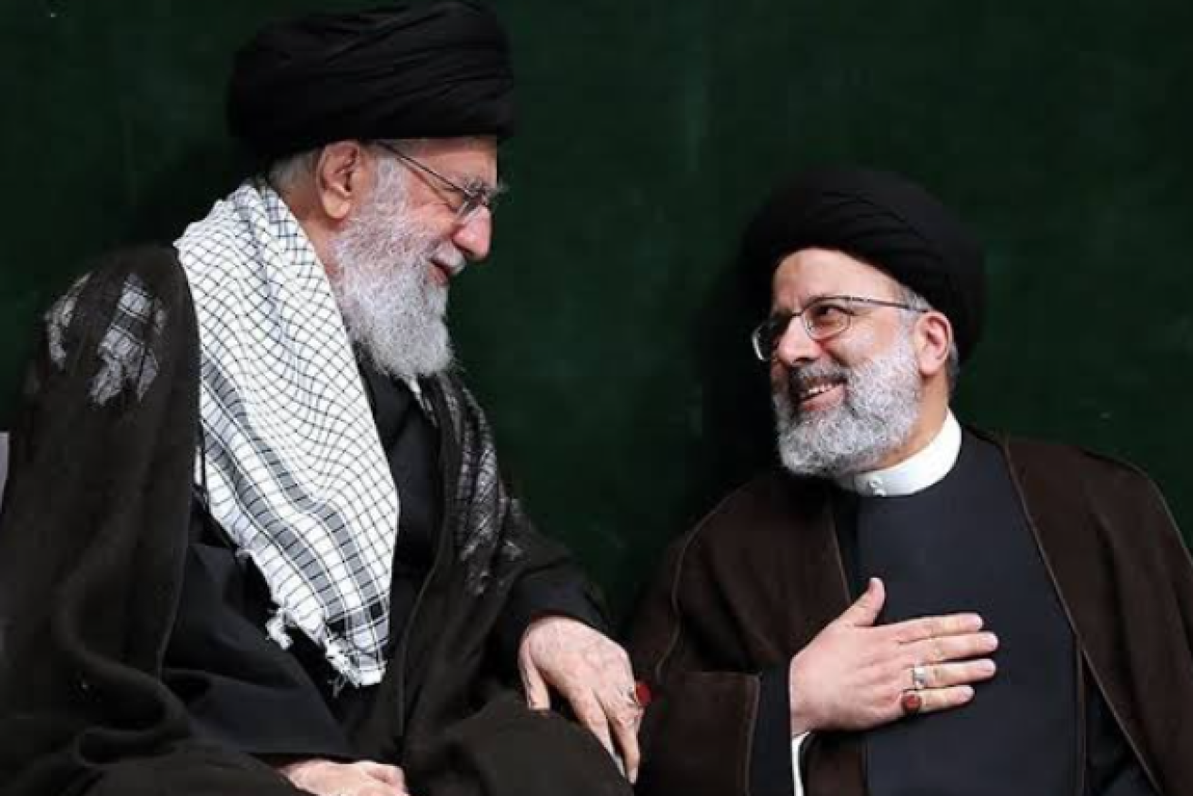 Iran's Supreme Leader Ayatollah Ali Khamenei shares a smile with protege Ebrahim Raisi as the votes were counted.
