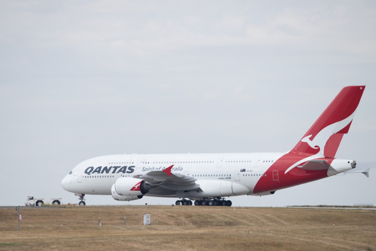 An infectious person managed to hop on a Qantas flight to Wellington on Friday.