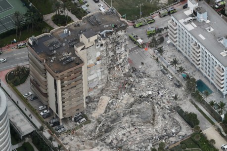 Frantic search after high-rise apartment collapses