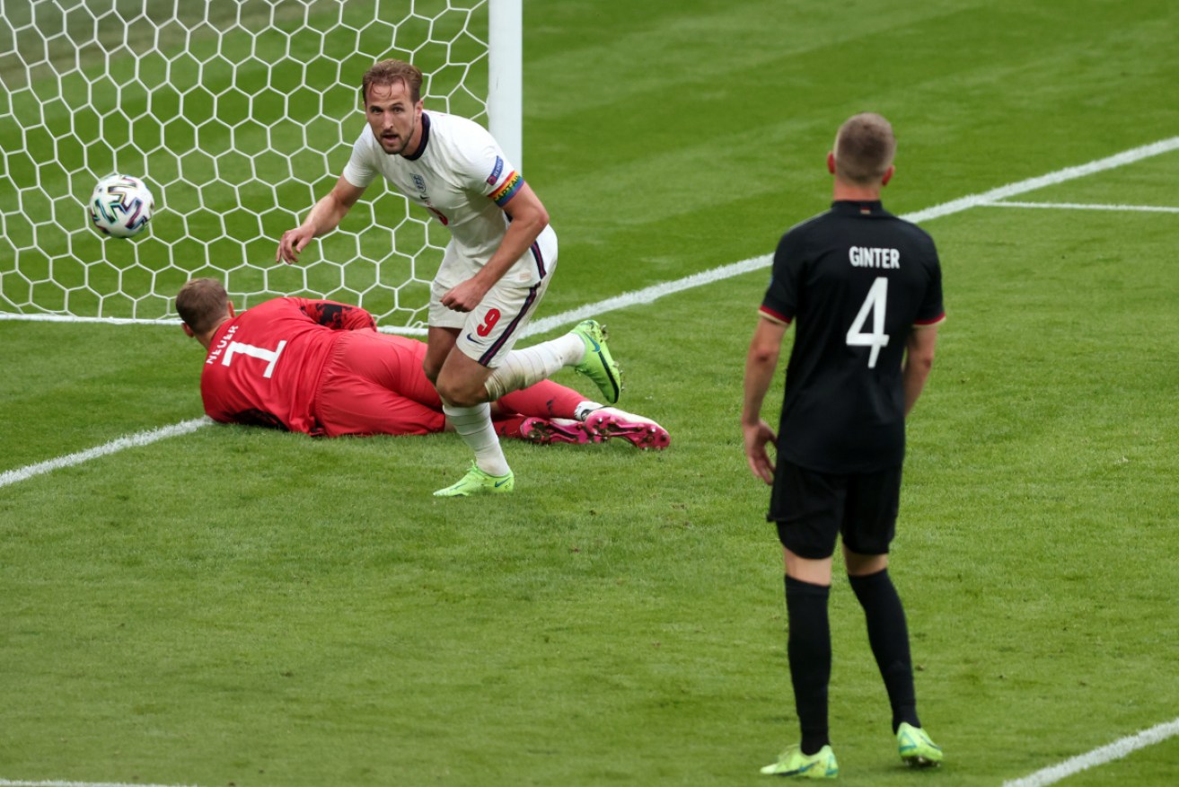 Harry Kane wheels away after scoring England's second goal against Germany,.