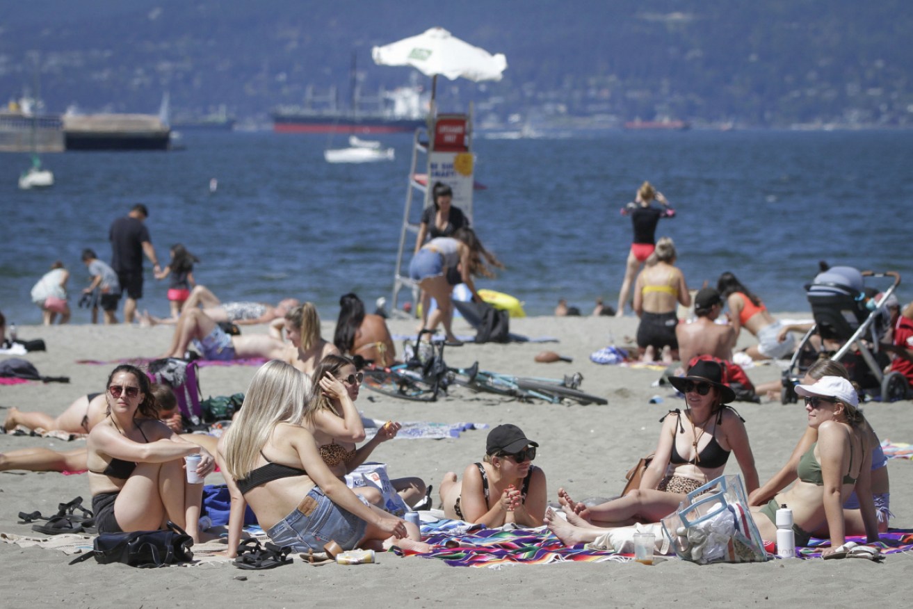 Crowds have flocked to Vancouver beaches as temperatures have risen.
