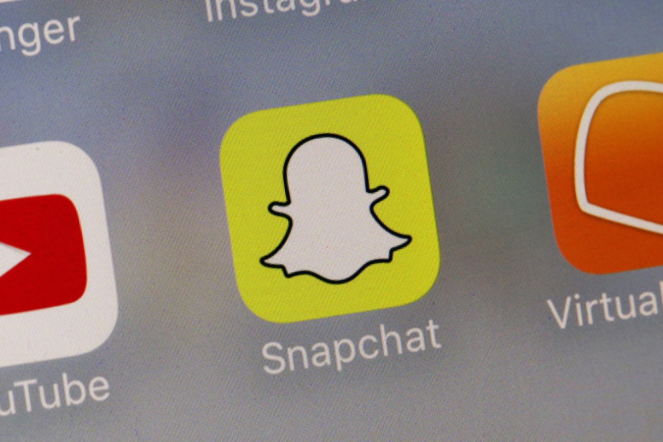 A woman blackmailed her ex-boyfriend's new partner, posting a topless picture of her on Snapchat.