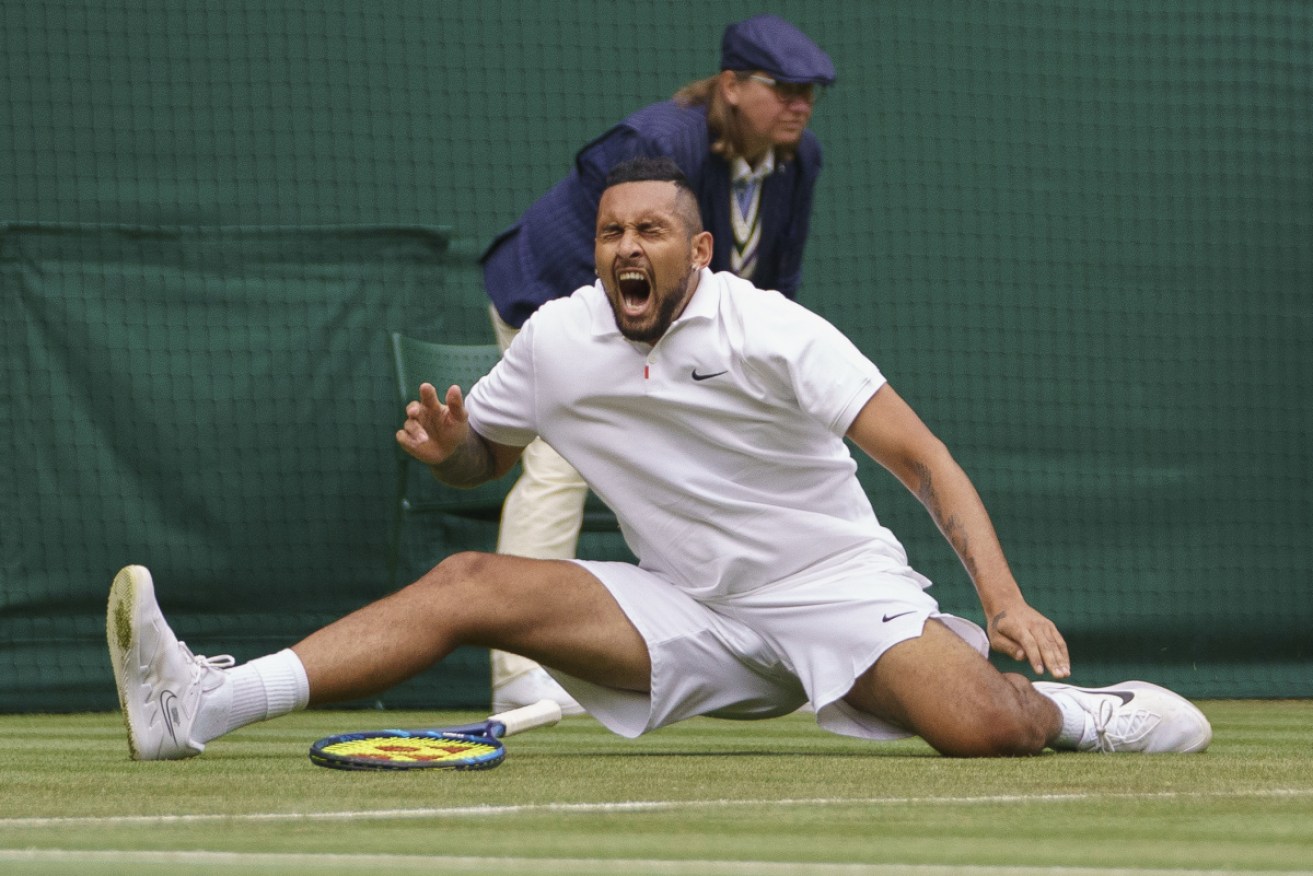 Nick Kyrgios overcame the pain of a fall to advance to the next round at Wimbledon.