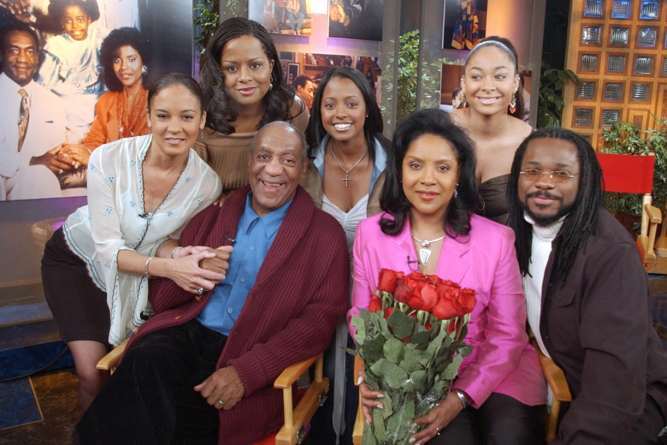 Bill Cosby with his TV family in 2002, including Phylicia Rashad (in pink jacket).