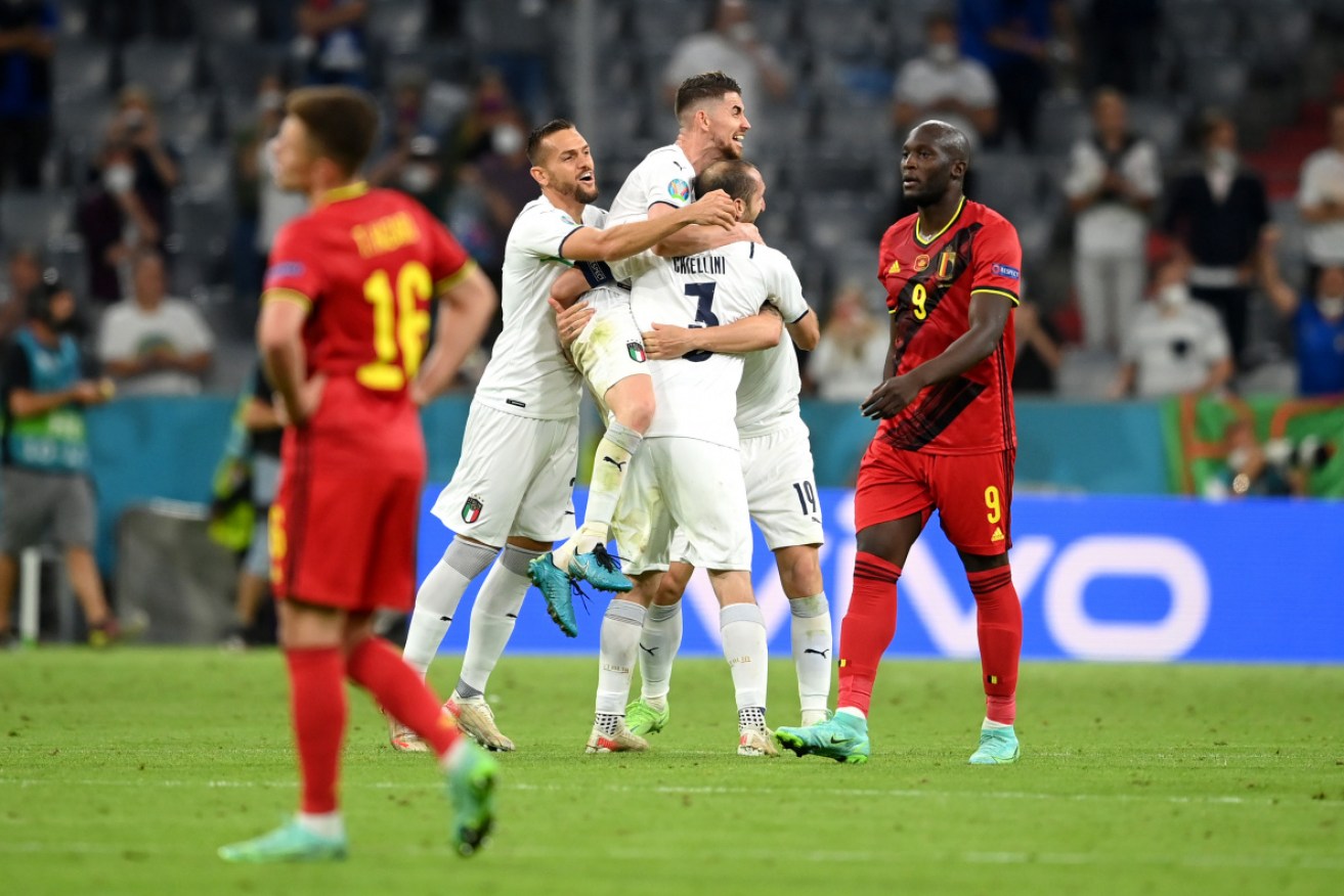 Italy's players celebrate defeating Belgium.