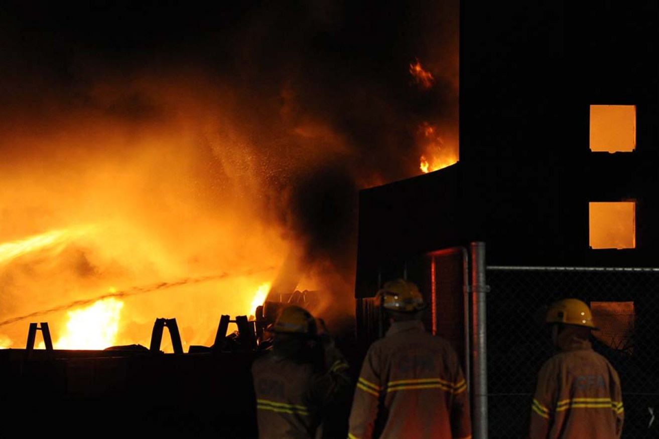 A man accused of burning down a Melbourne warehouse has been charged with possession of explosives. 