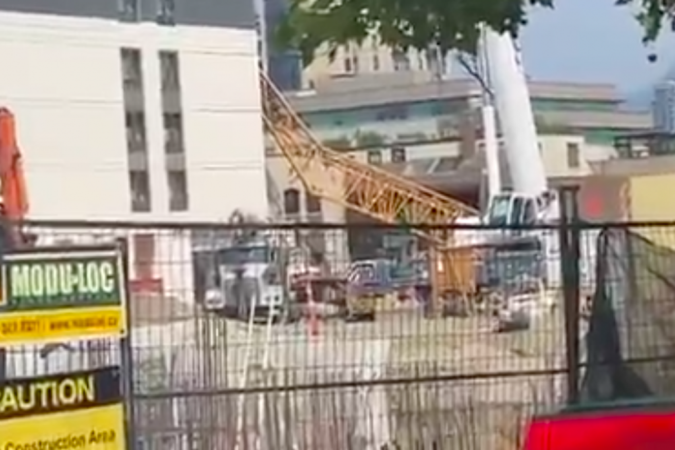 Several workers were near the crane when it collapsed.