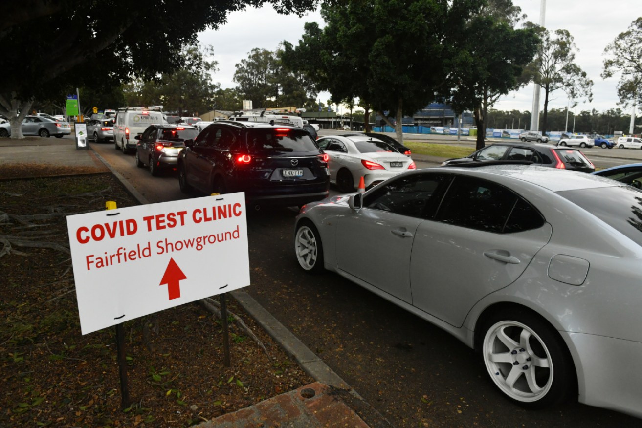 Long queues of cars are seen at a pop up Covid testing clinic at the Fairfield Showgrounds in Sydney on Wednesday morning.