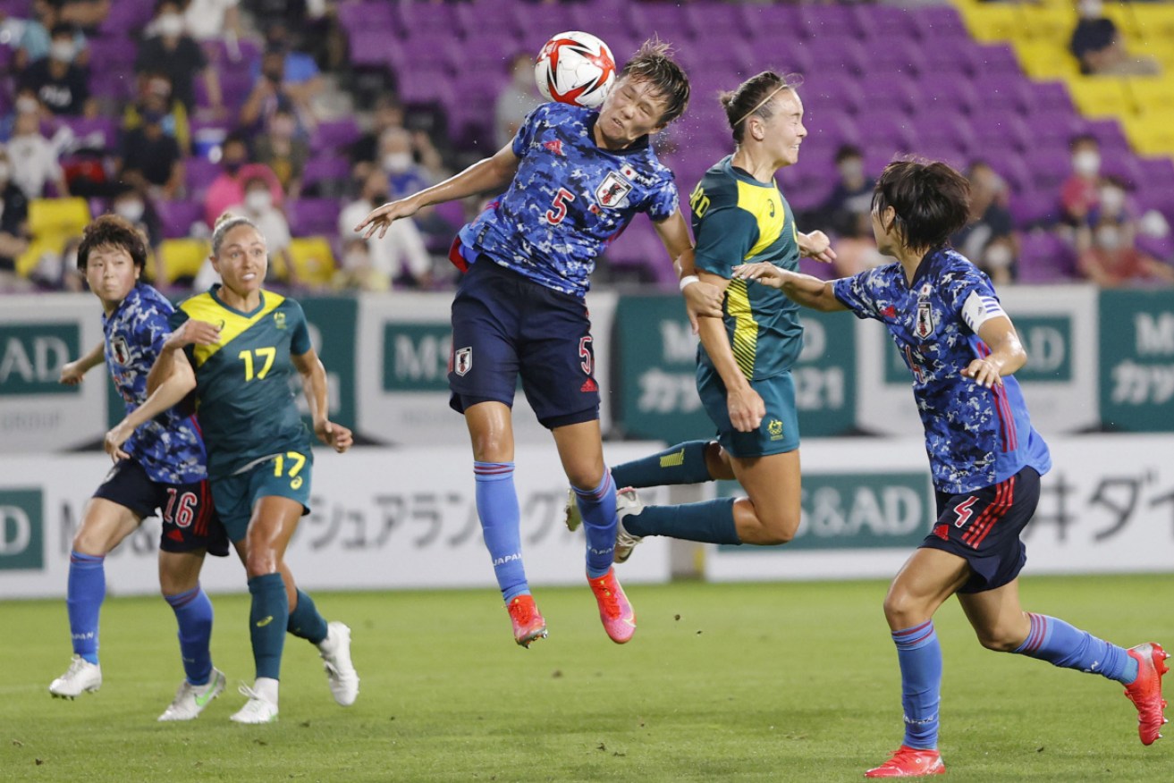 Japan's Moeka Minami and Australia's Caitlin Foord vie for the ball during Wednesday’s friendly in Kyoto.