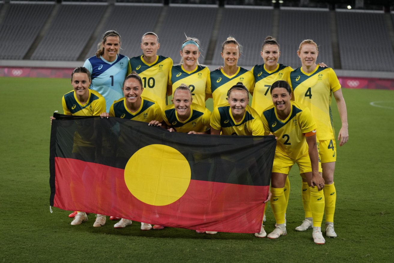 The Matildas posed for a group photo with an indigenous flag ahead of their Olympics opener against New Zealand.
