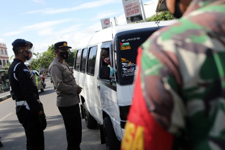 Indonesia extends virus restrictions by a week