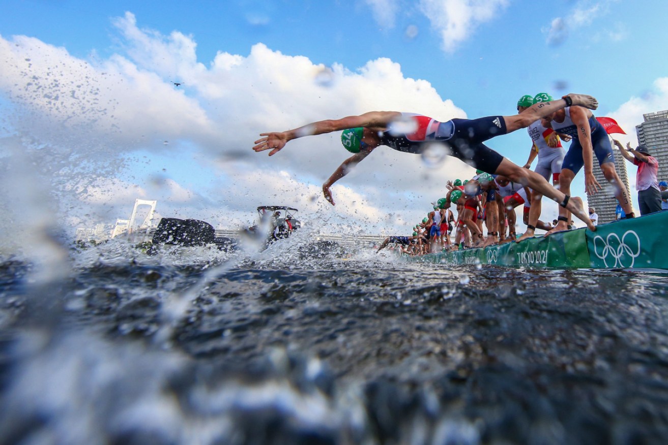 The men's triathlon final had to be restarted after a camera boat blocked half the field from diving into the water.