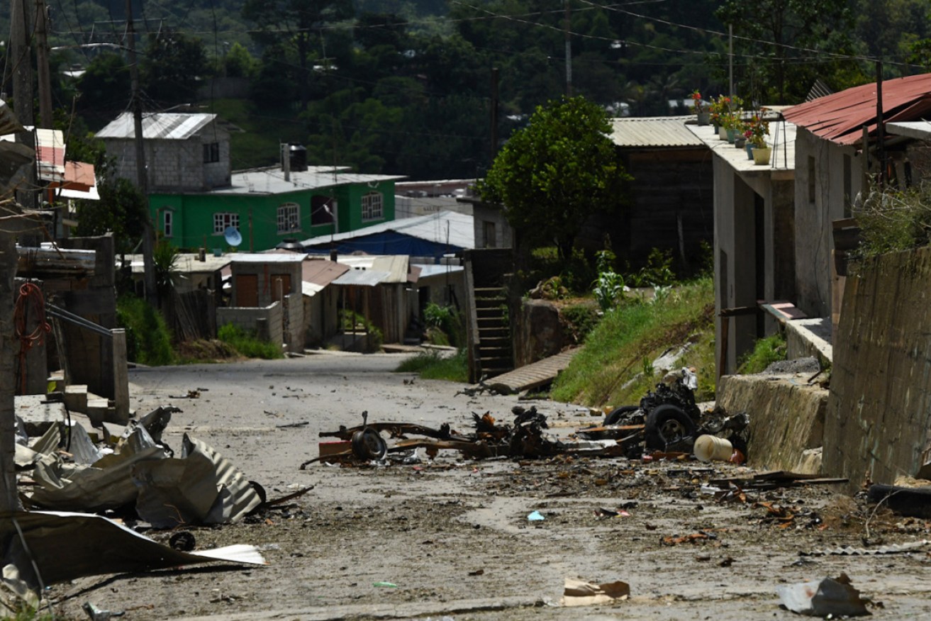 The village, a day after an armed group ambushed police and members of the Mexican Army.