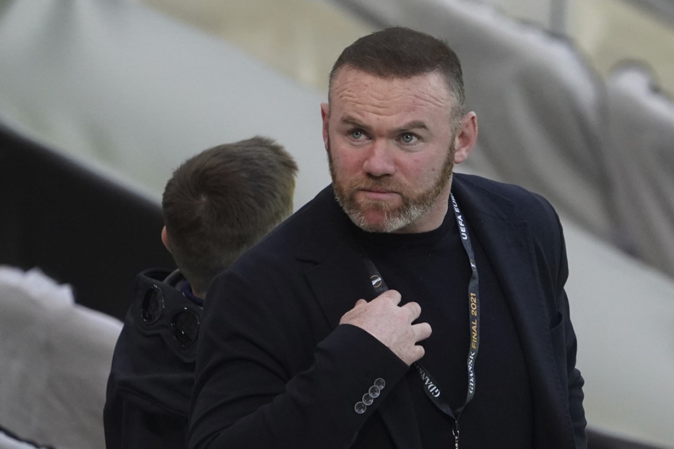 Derby coach Wayne Rooney has apologised to his family and club over photos taken of him at a party.