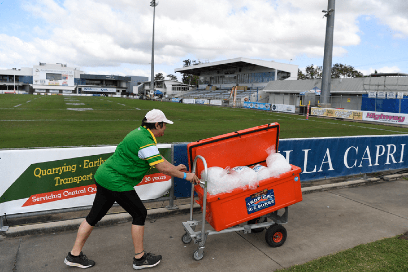 Game on ice: A food vendor packs away a load of ice after the Dragons clash with the Rabbitohs was cancelled.