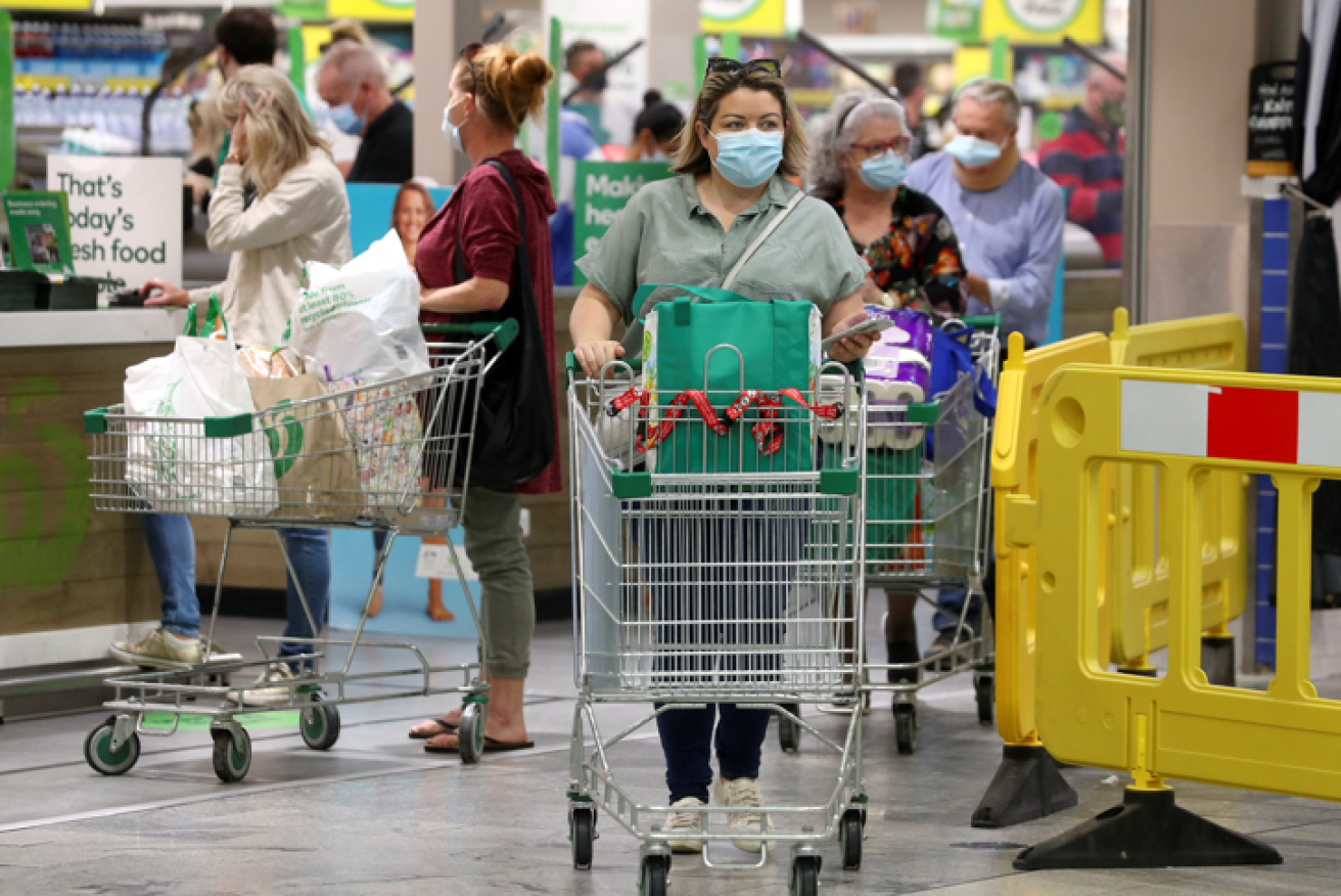 Supermarkets in lockdown districts were packed with shoppers stocking up on provisions.