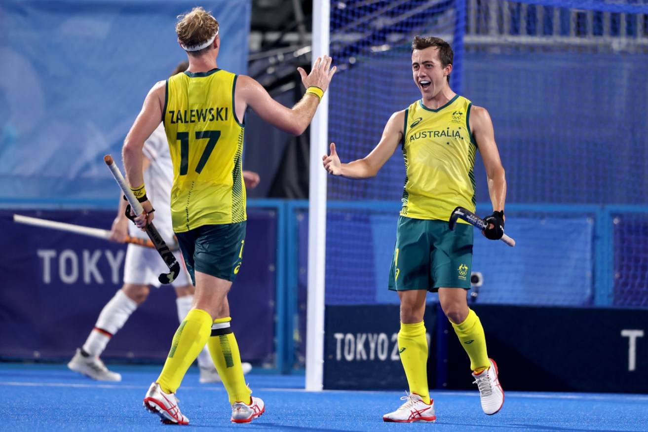 Lachlan Thomas Sharp and Aran Zalewski celebrate Australia's third goal on Tuesday night.