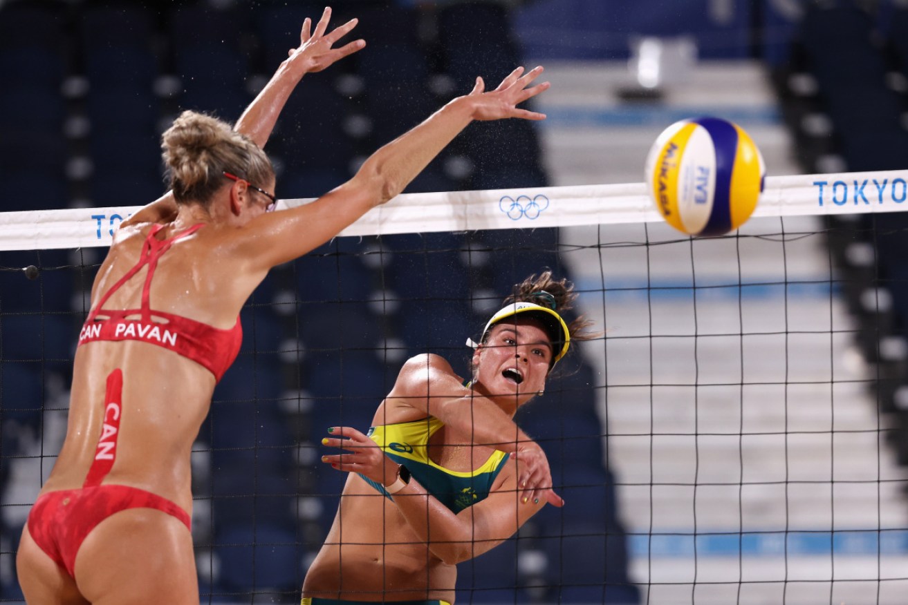 Mariafe Artacho del Solar spikes the ball past Canada’s Sarah Pavan in Tuesday night’s quarter-final upset.