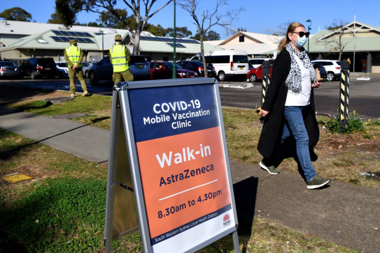 ADF personnel oversee a walk-in vaccination clinic at Wattle Grove in Sydney on Tuesday. 