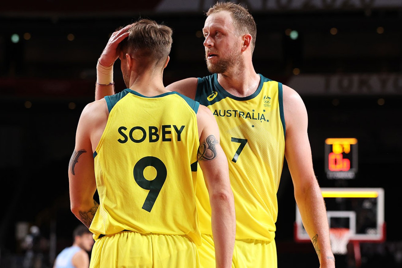 Joe Ingles lauds Australian teammate Nathan Sobey in the second half on Tuesday night.  