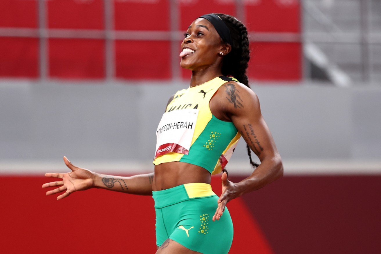 Elaine Thompson-Herah of Team Jamaica celebrates after winning  the 200m final. 