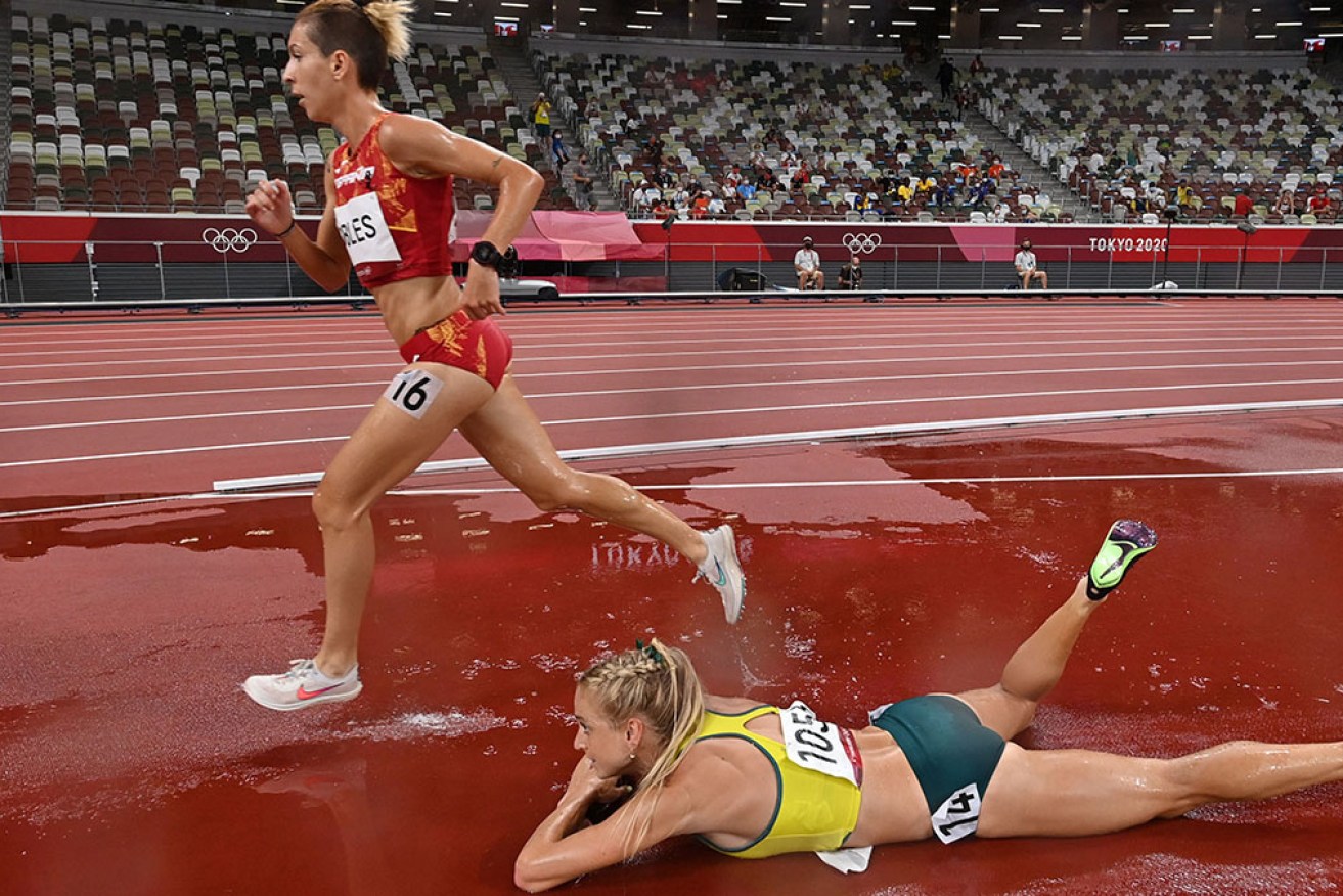 An achilles injury leaves Australia's Genevieve Gregson on the floor in the women's 3000m steeplechase final. 