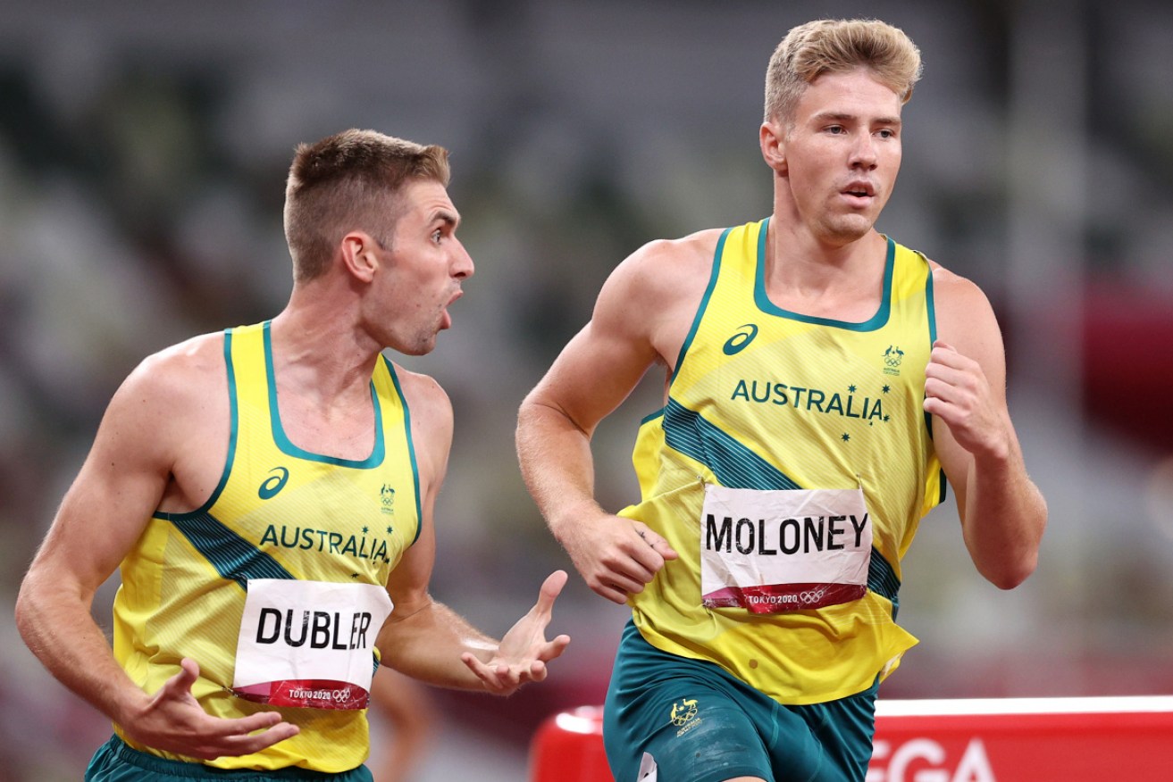 Cedric Dubler urges on Ashley Moloney in the 1500m to a decathlon bronze medal.