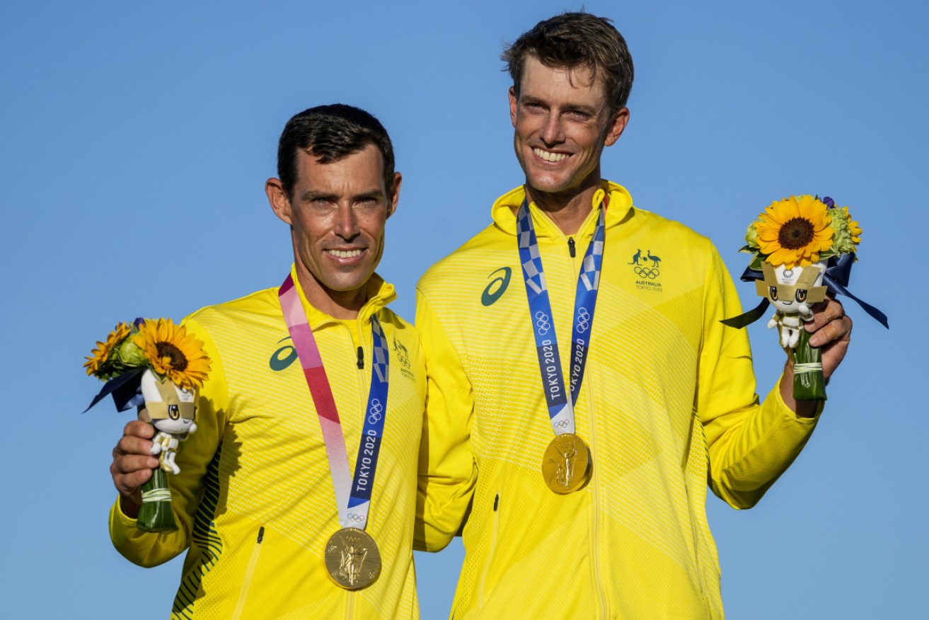 Decorated sailor Mat Belcher (left) will carry the Australian flag at the Olympic closing ceremony.