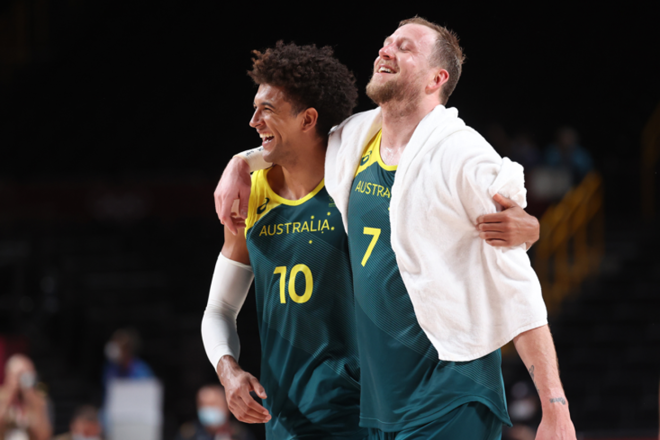 Matisse Thybulleand Joe Ingles celebrate their historic win over Slovenia to wrap up the bronze medal.