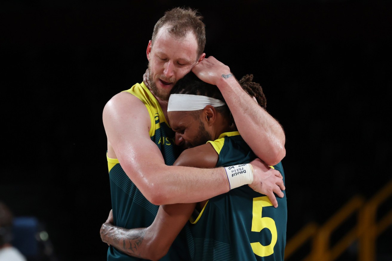 Joe Ingles and Patty Mills embrace after Australia's greatest-ever basketball achievement. <i>Photo: Getty</i>