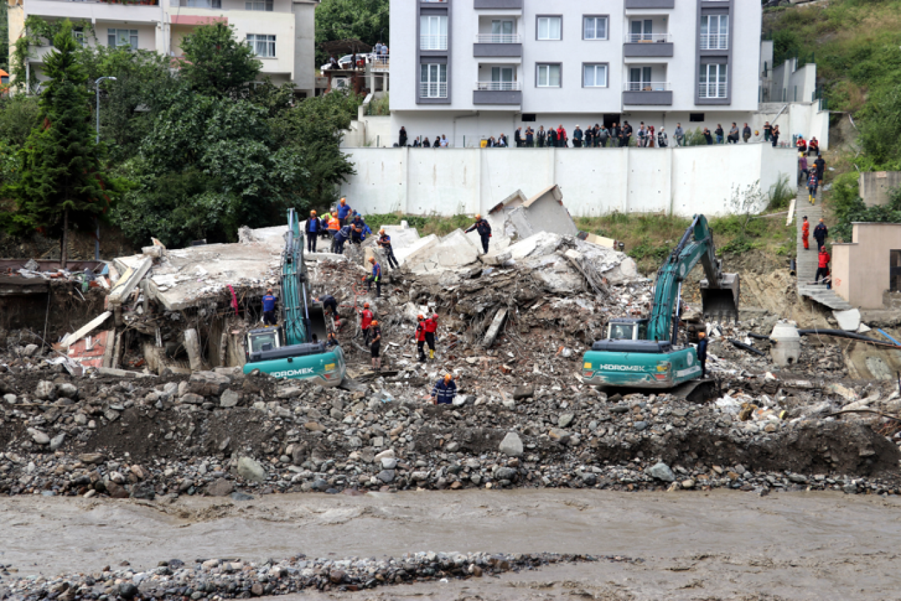 Just days this pile of sodden rubble was home. Then the rains washed everything away.