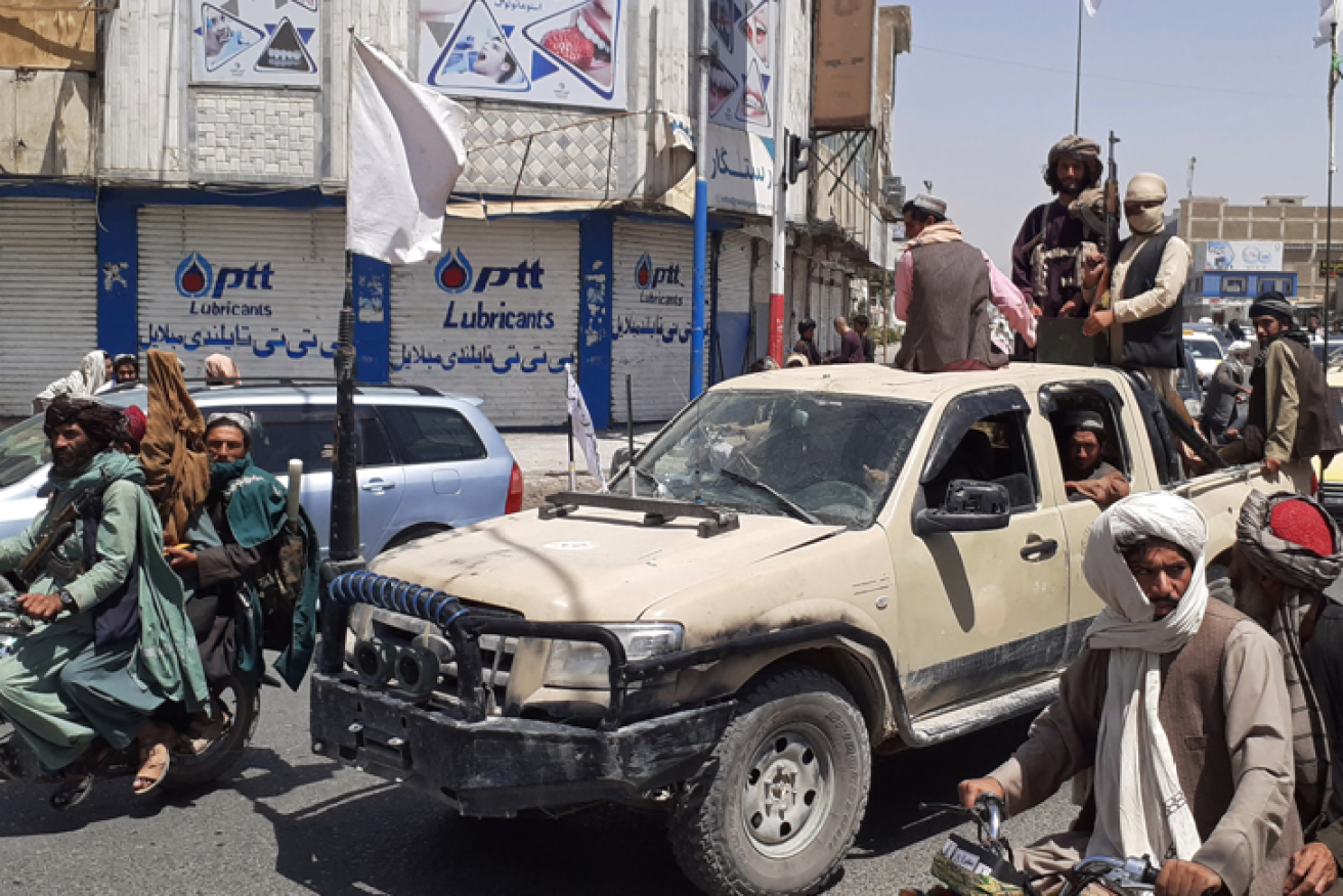 Just last week that pickup belonged to the Afghan army. Now it is part of the Taliban's victory parade through Kandahar.