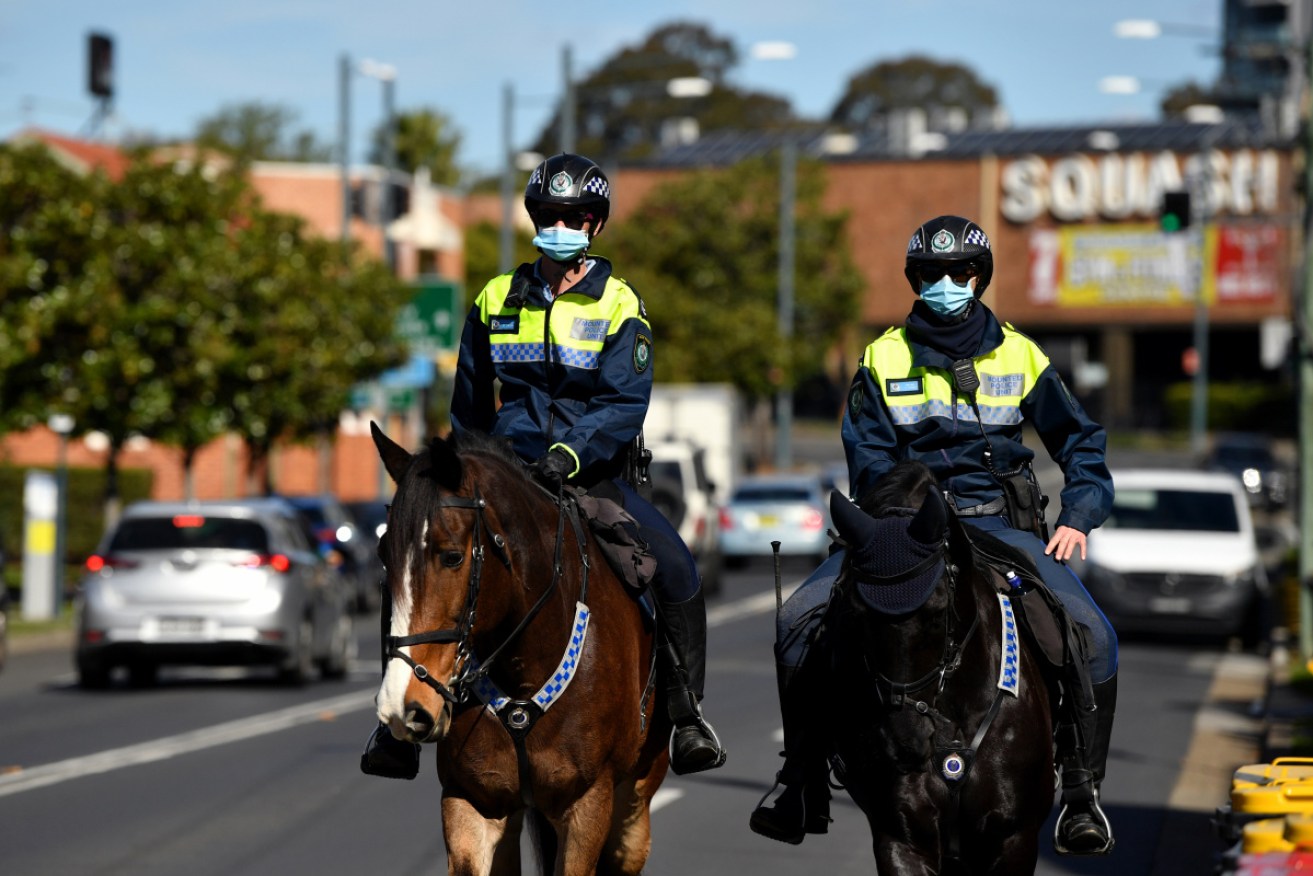 Police say the five men were fined $5000 each and escorted back home to isolate.