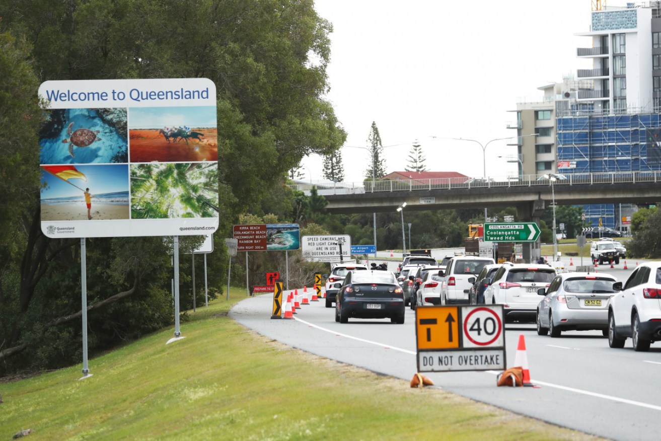 There have been delays at the Queensland-NSW border after rules were tightened.
