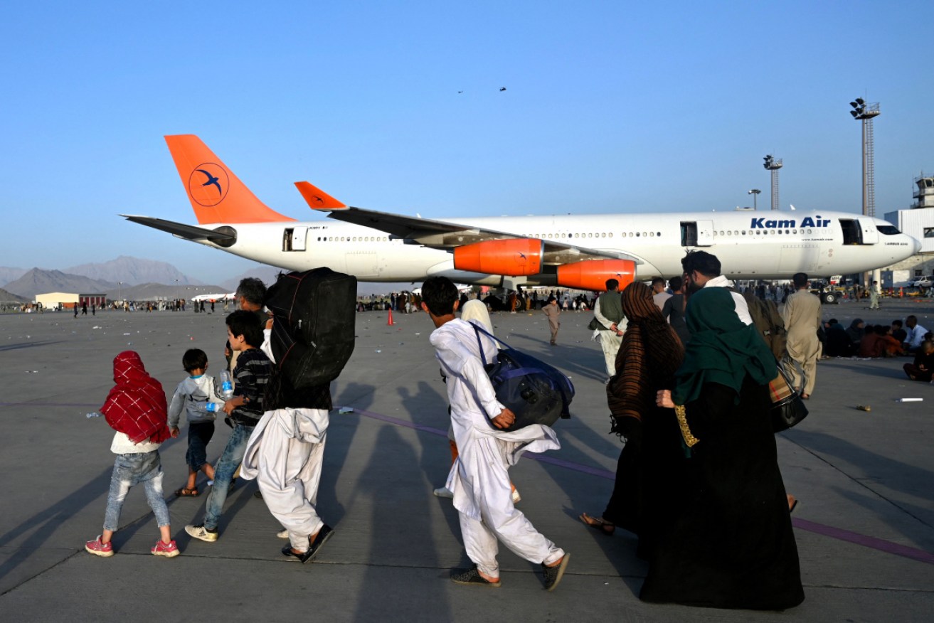 There have been wild scenes at Kabul Airport after the Taliban's takeover of the city.